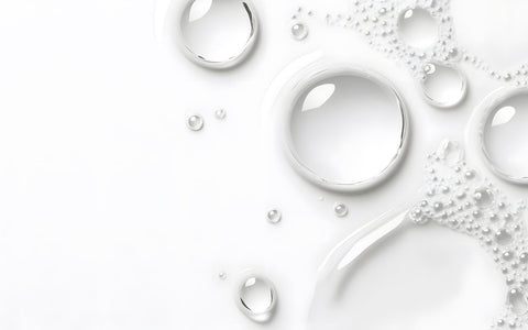 Women applying vitamin c serum on face